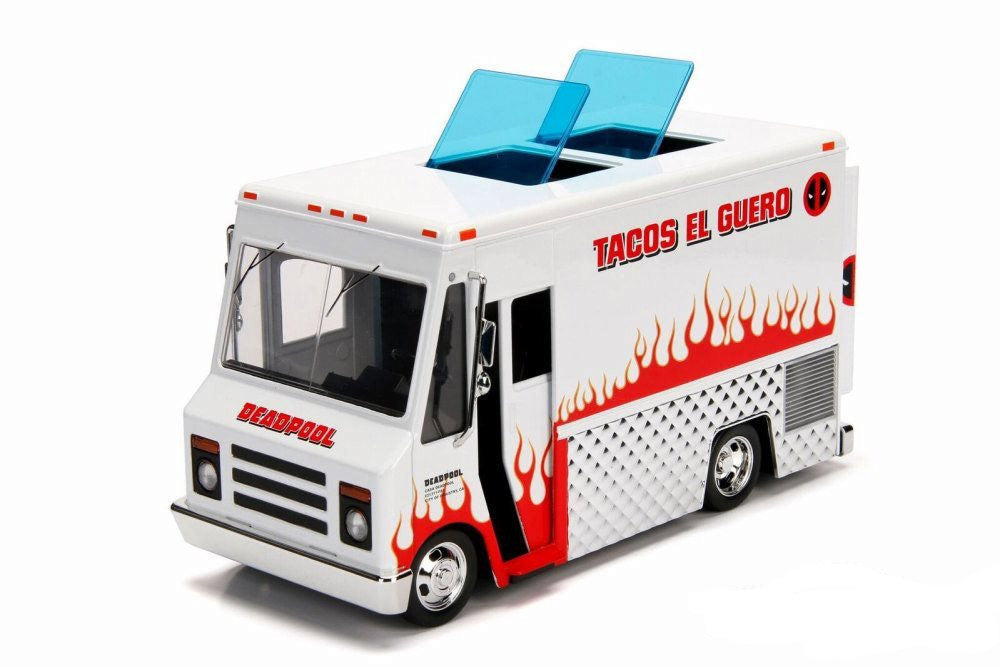 Model toy truck resembling a food truck with 'Tacos El Guero' branding on a white background.